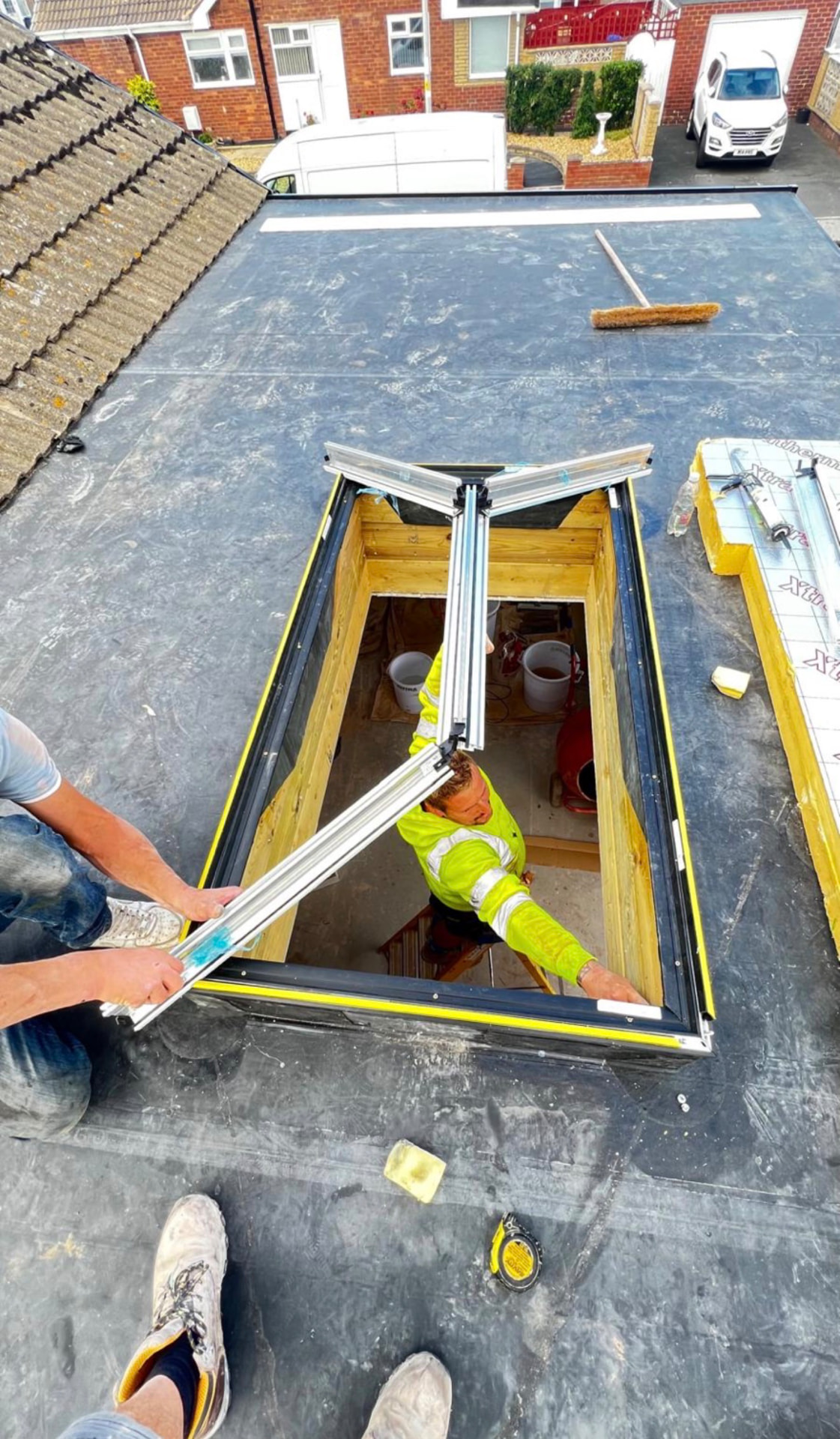Rooflight being installed into a flat roof