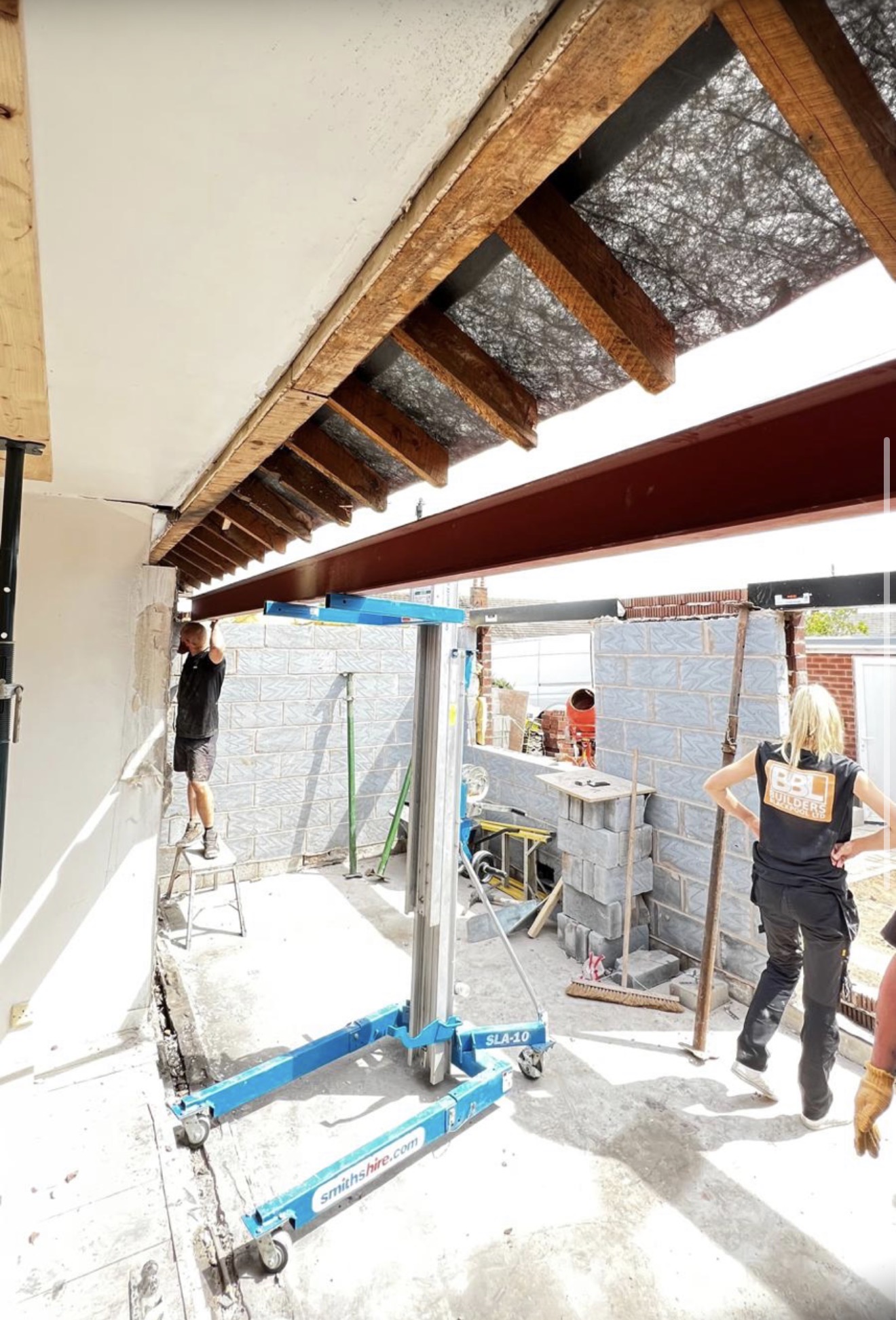 Builders Blackpool team opening a property and installing structural steel