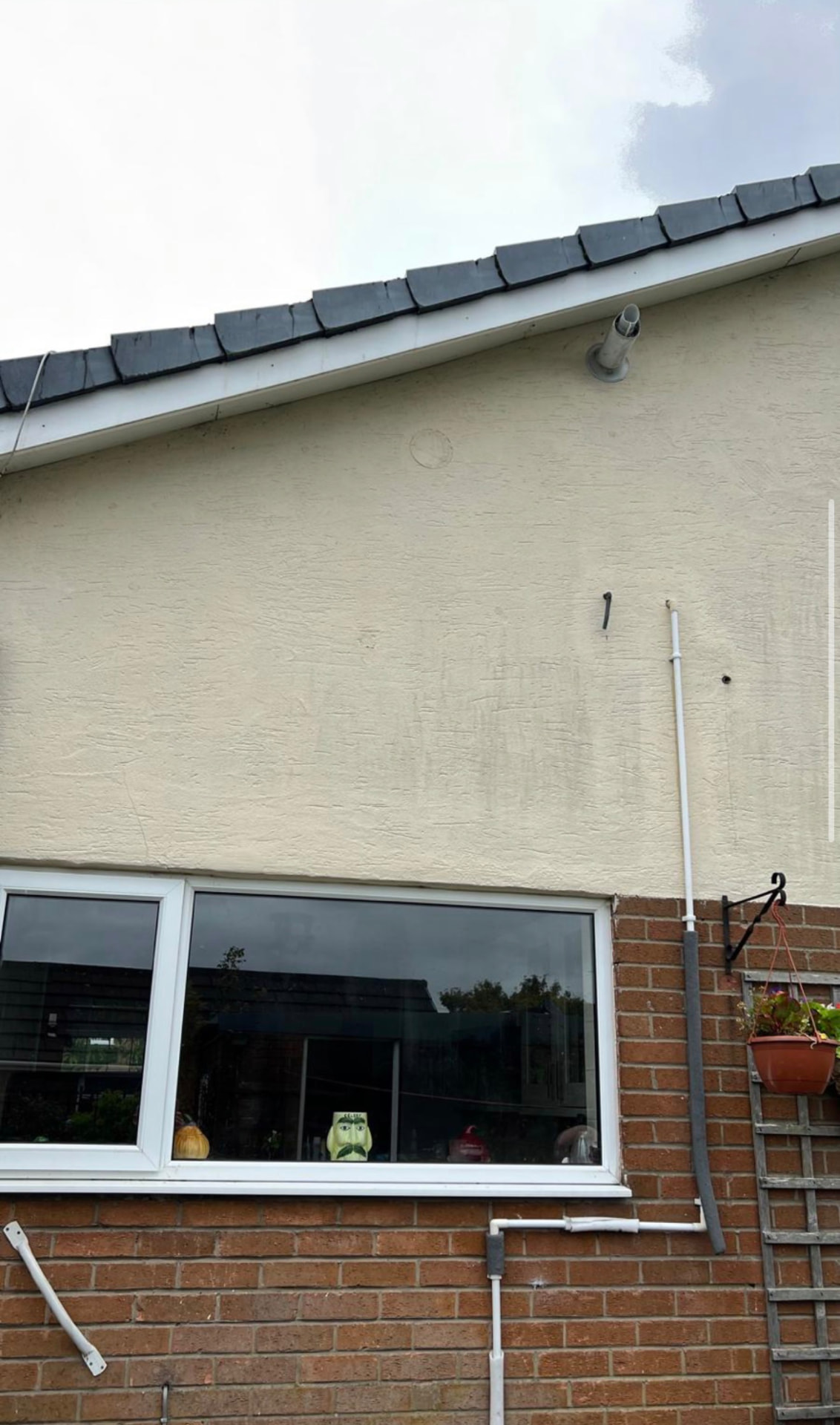 Finished exterior render above a rear window